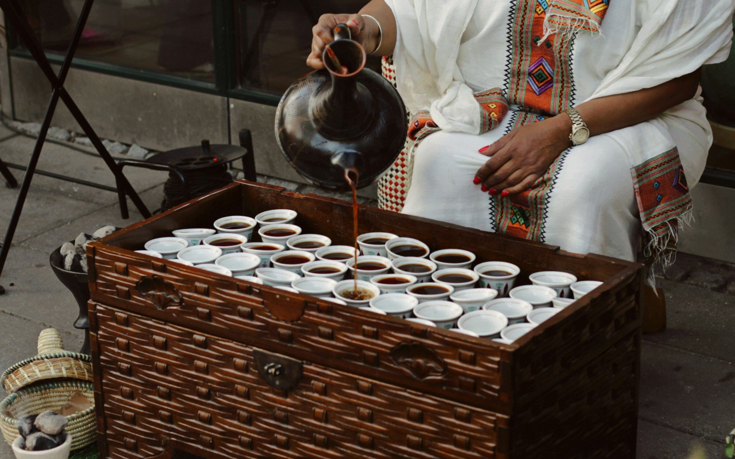 Coffee poured into small cups during an Ethiopian coffee ceremony