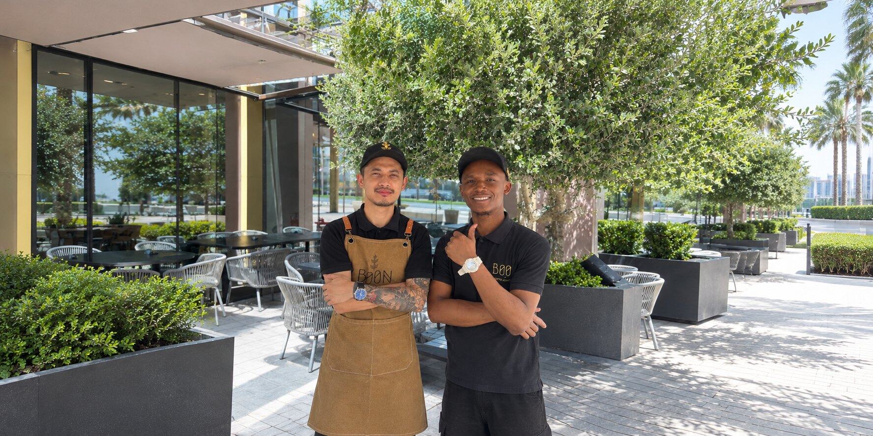 Two Boon baristas on the café patio