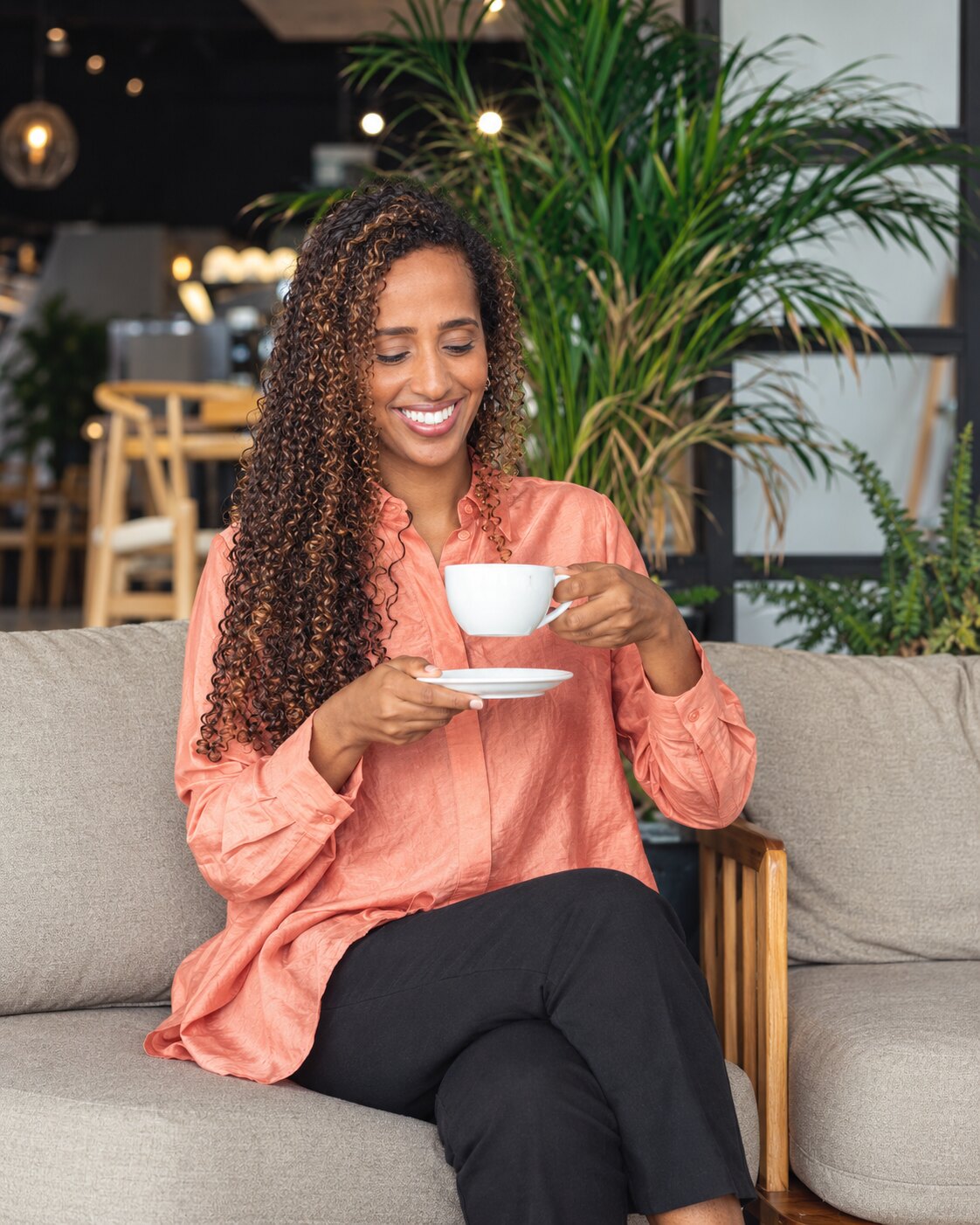 Orit Mohammed, founder of Boon Coffee, with a cup at a Boon café