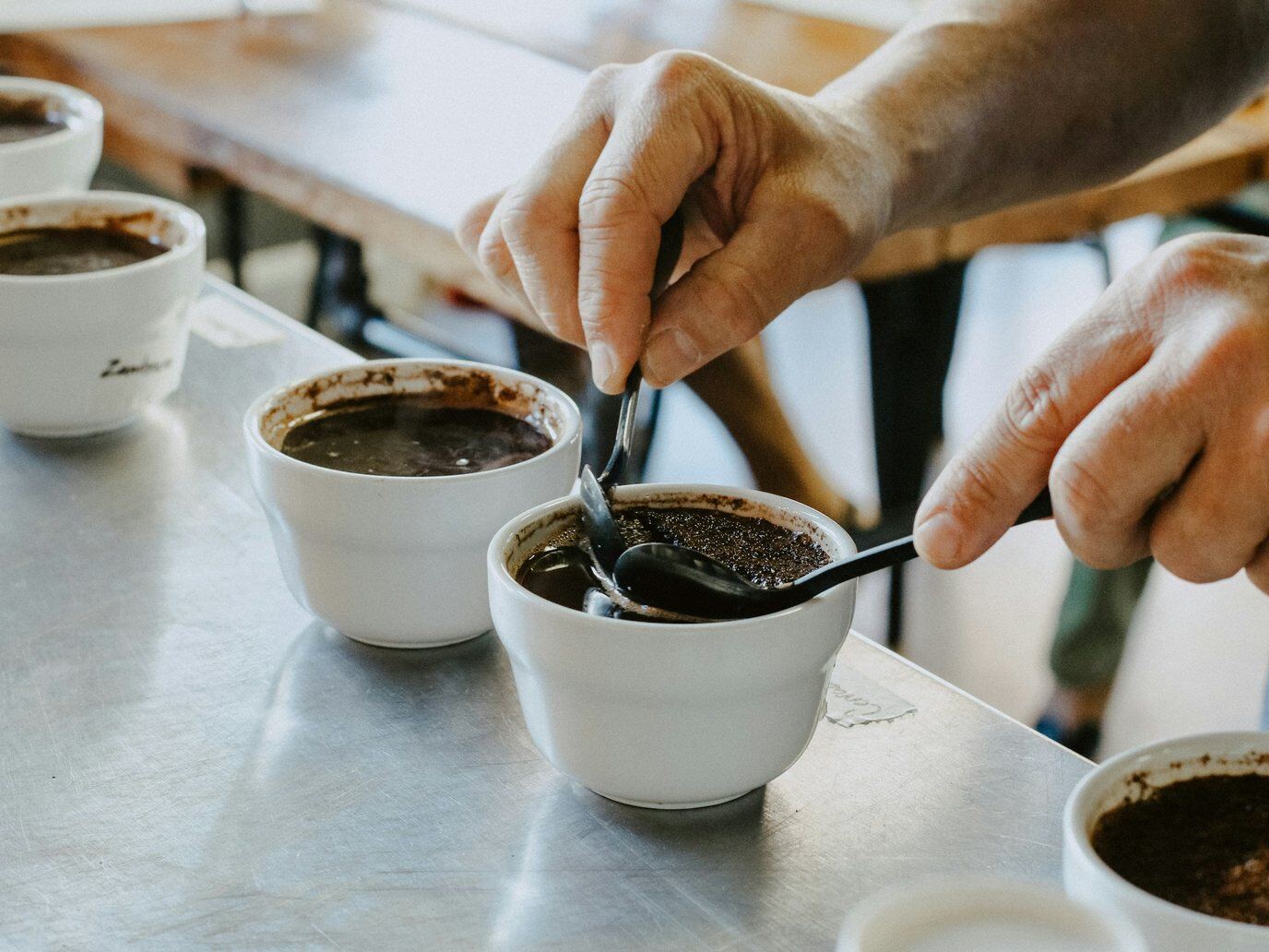 Cupping spoons at a coffee tasting table